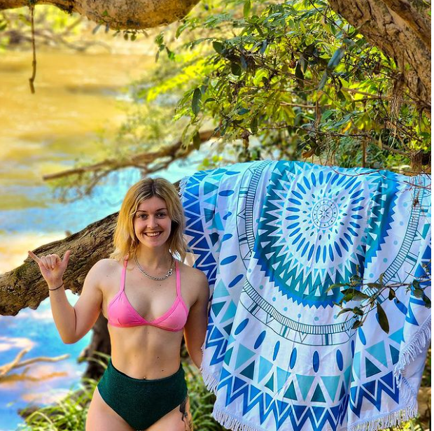 Bohemian blue beach towel on a beach backdrop